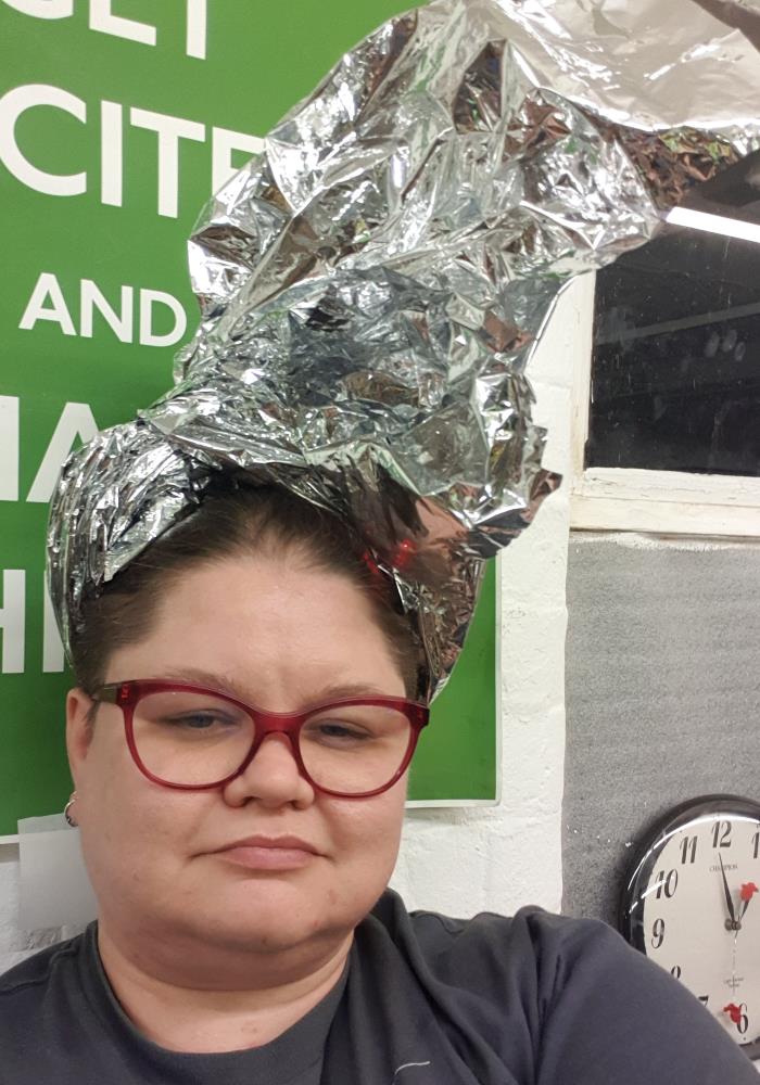 Me wearing the remnants of the Mylar blanket tied up as a very elaborate hat.